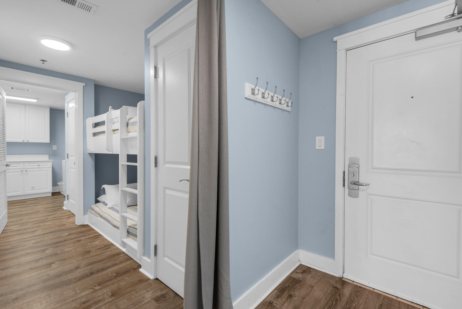 1110 Santa Rosa Boulevard, Unit B501 Fort Walton Beach, FL 32548 - Photo 39 of 51 a view of a hallway with wooden floor and staircase