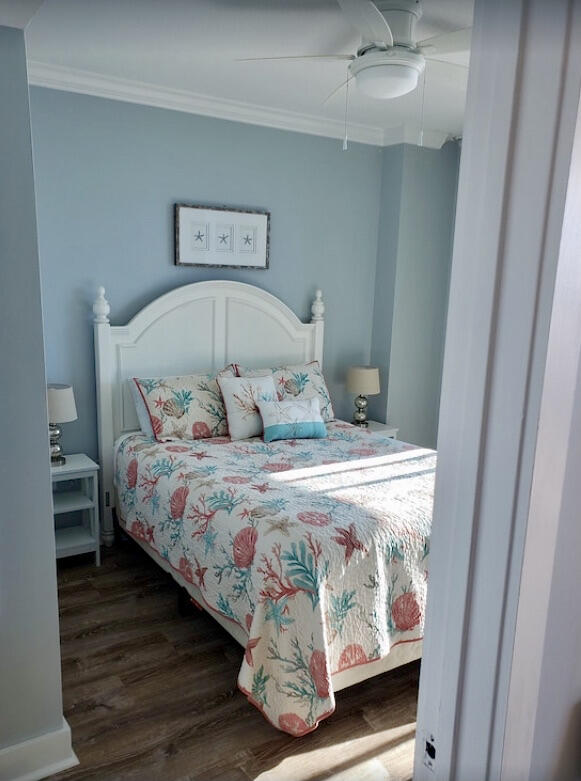 1110 Santa Rosa Boulevard, Unit B501 Fort Walton Beach, FL 32548 - Photo 43 of 51 a bedroom with a bed and a mirror