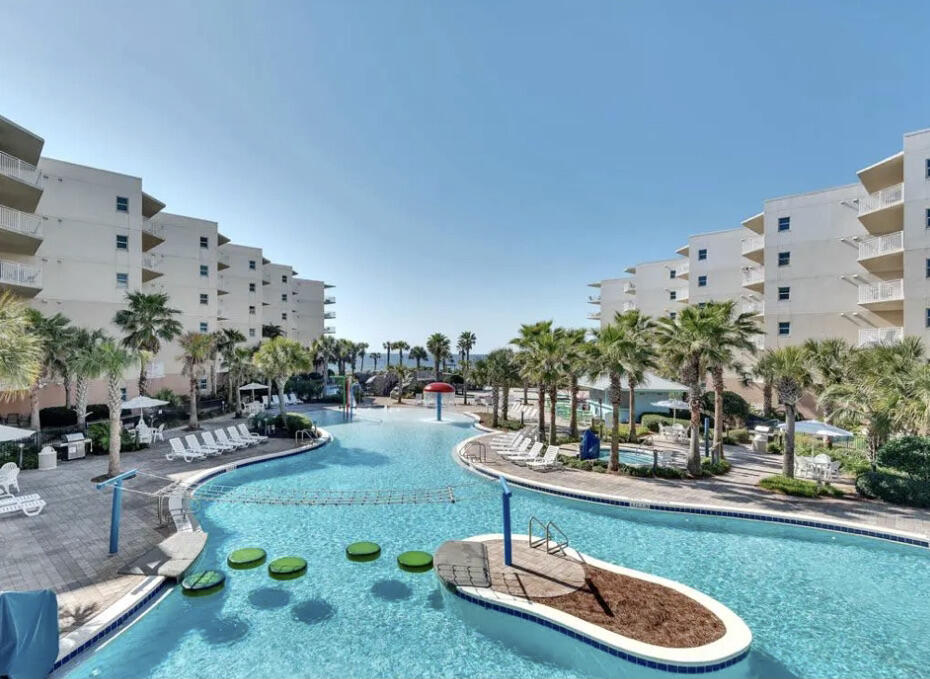 1110 Santa Rosa Boulevard, Unit B501 Fort Walton Beach, FL 32548 - Photo 50 of 51 a swimming pool with outdoor seating and yard