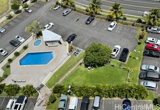 an aerial view of a house with a yard and garden