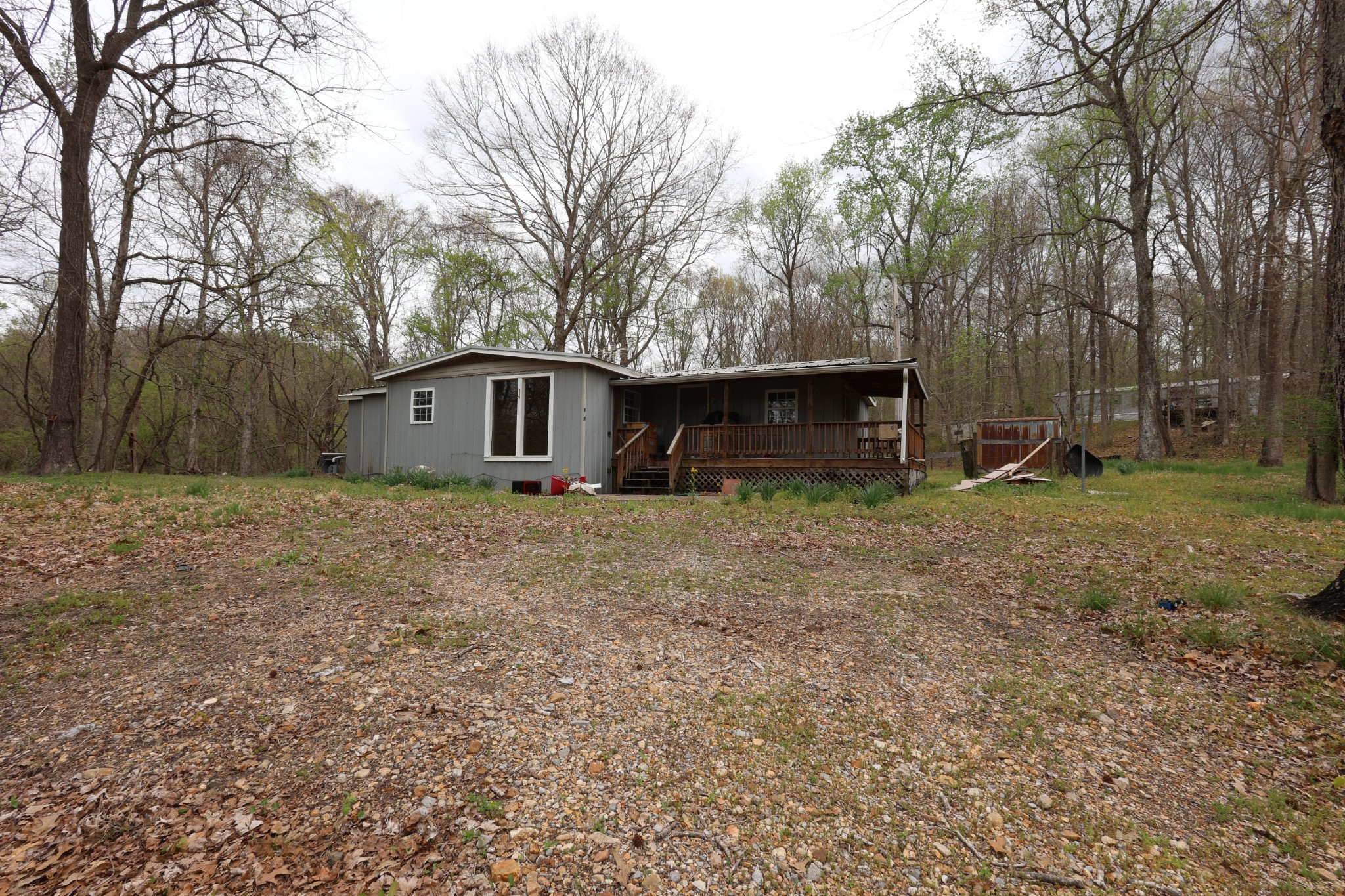 a front view of house with yard and trees