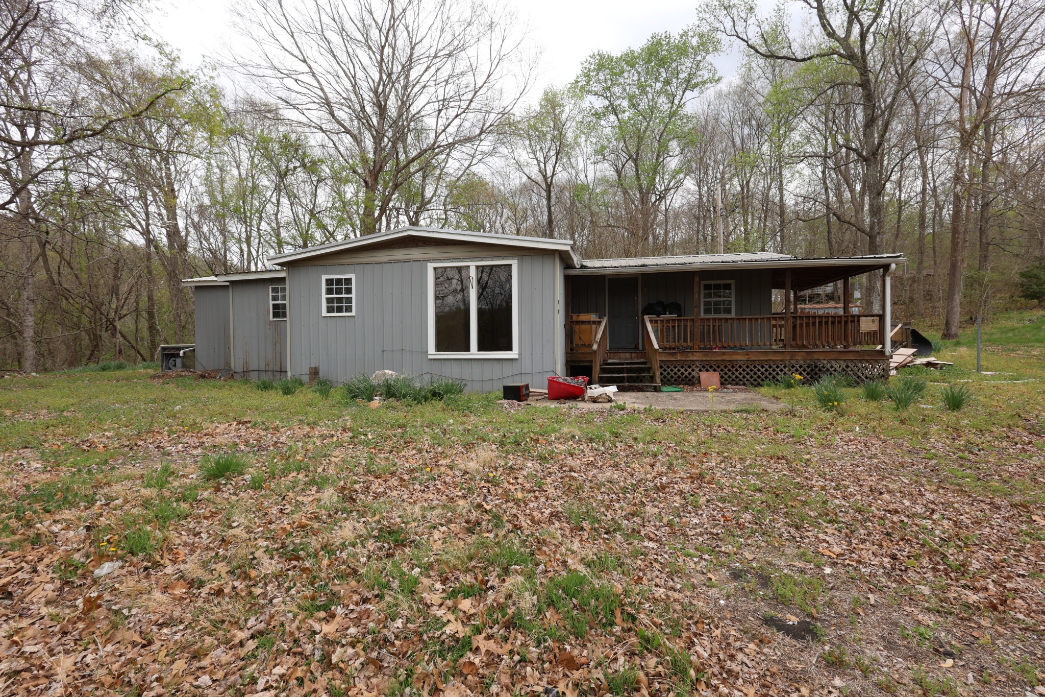 109 Furnace Hill Road Indian Mound, TN 37079 - Photo 2 of 17 a front view of house with yard and trees around