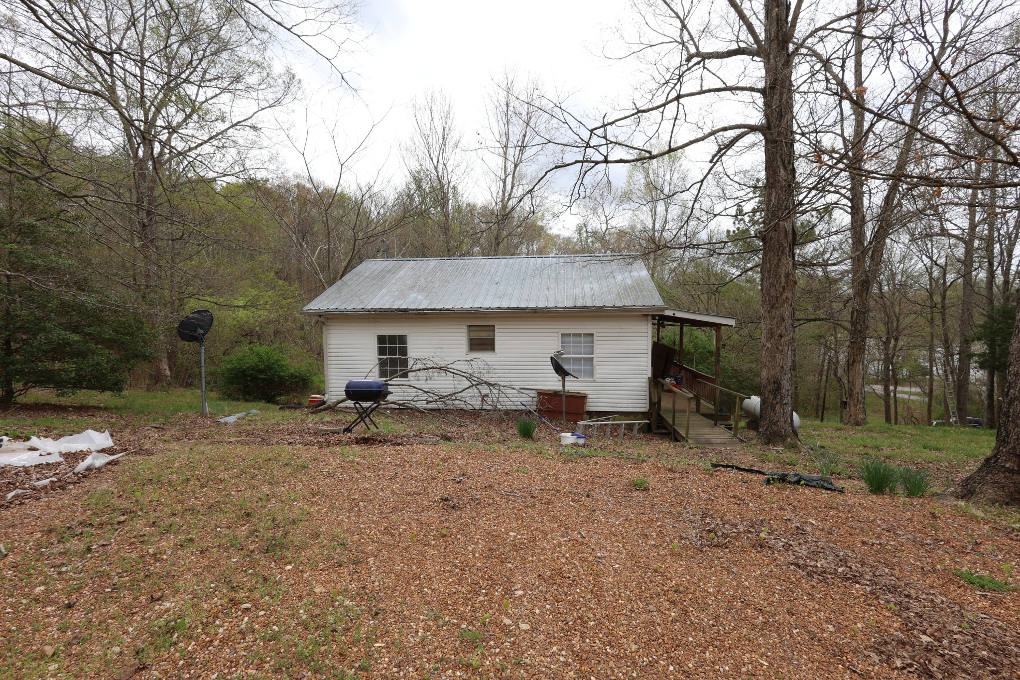 109 Furnace Hill Road Indian Mound, TN 37079 - Photo 8 of 17 a view of a house with a yard and sitting area