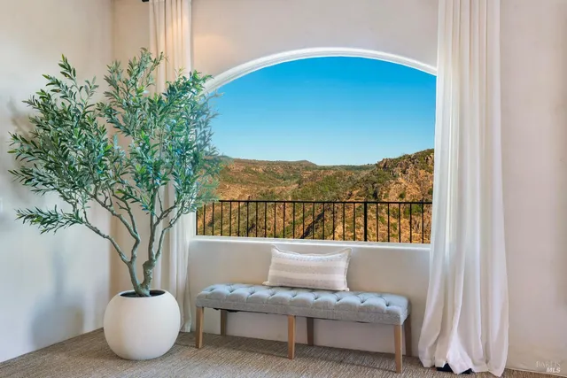 a bedroom with a bed couch and a window