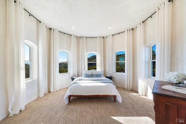 a view of a chairs and table in patio