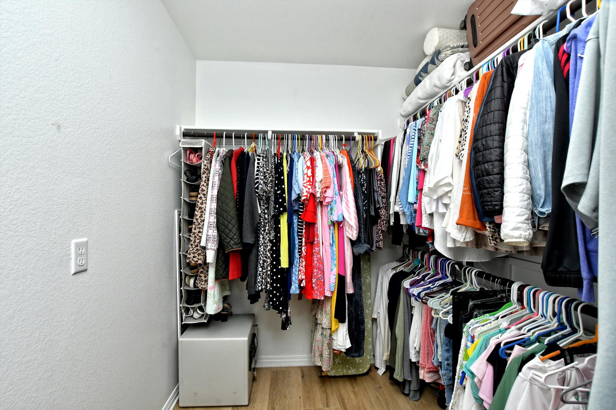 231 Hobby Street Georgetown, TX 78633 - Photo 17 of 29 Organized clothing racks line the walls of this highly functional walk-in closet.