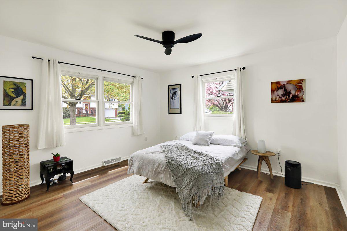 521 Hummingbird Drive Lititz, PA 17543 - Photo 17 of 38 a bedroom with a bed and wooden floor