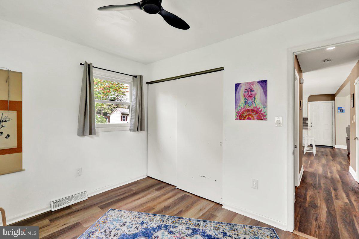 521 Hummingbird Drive Lititz, PA 17543 - Photo 19 of 38 a view of an empty room with wooden floor and a window