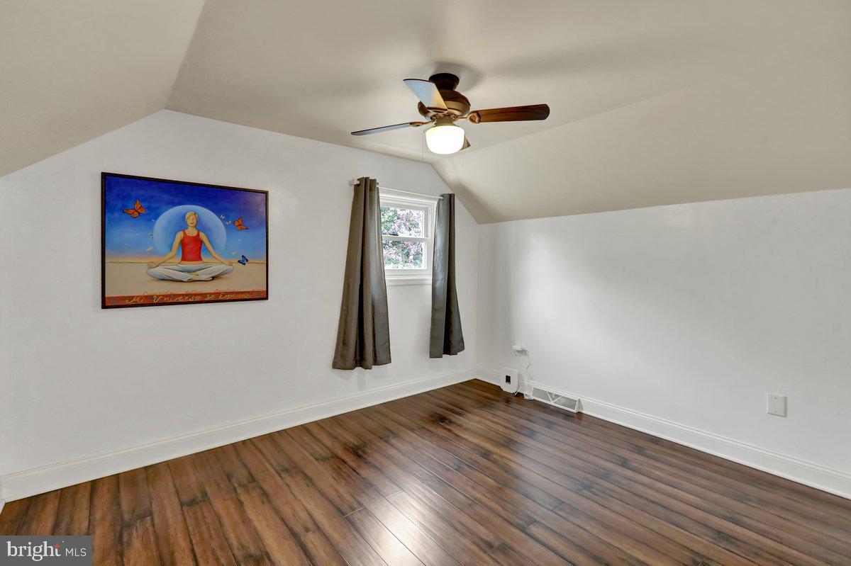 521 Hummingbird Drive Lititz, PA 17543 - Photo 25 of 38 a view of a room with wooden floor ceiling fan and window