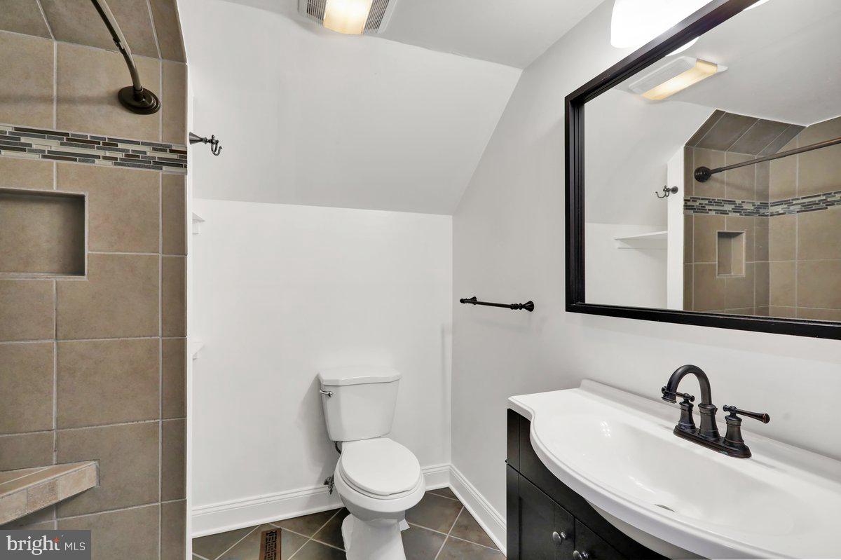 521 Hummingbird Drive Lititz, PA 17543 - Photo 30 of 38 a bathroom with a sink a toilet and mirror