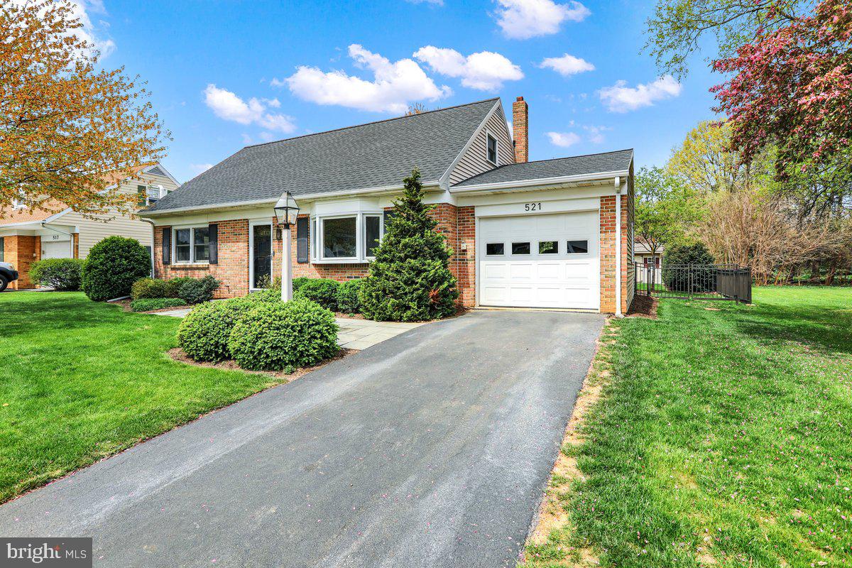 521 Hummingbird Drive Lititz, PA 17543 - Photo 3 of 38 a front view of a house with a yard and garage