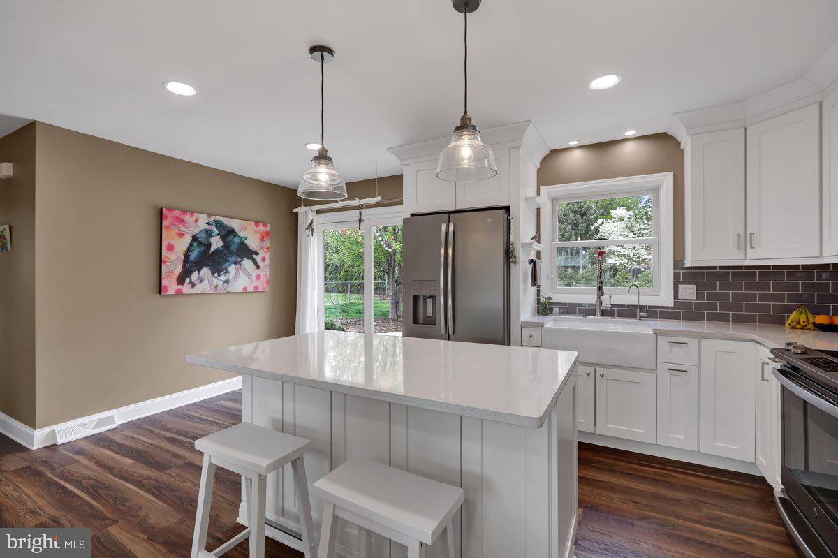 521 Hummingbird Drive Lititz, PA 17543 - Photo 10 of 38 a large kitchen with a table and chairs in it