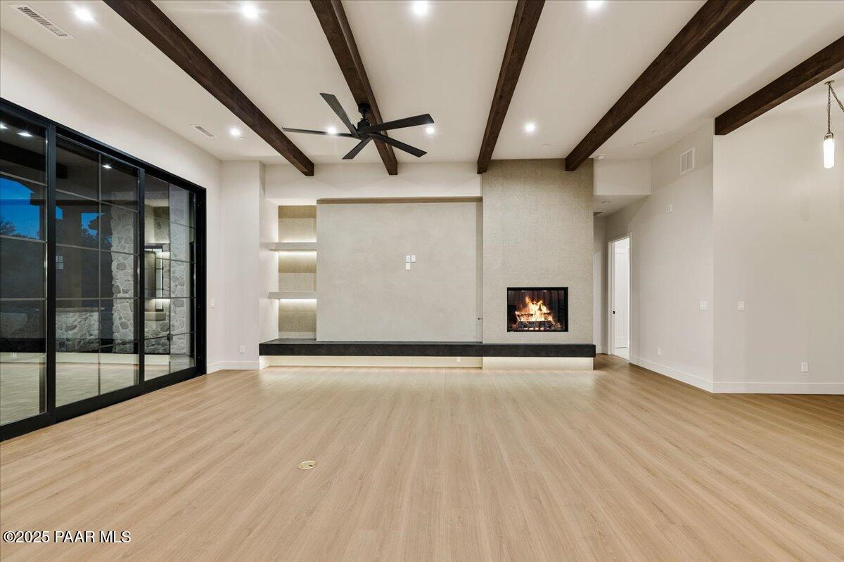 125 Rotonda Way Prescott, AZ 86301 - Photo 11 of 38 a view of an empty room with wooden floor and a window
