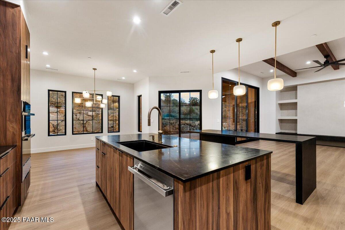 125 Rotonda Way Prescott, AZ 86301 - Photo 17 of 38 a kitchen with granite countertop a sink and counter space