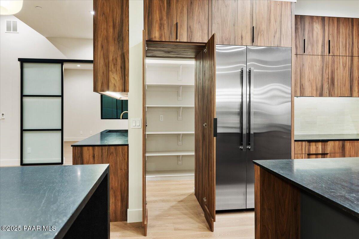 125 Rotonda Way Prescott, AZ 86301 - Photo 20 of 38 a kitchen with a refrigerator a sink and cabinets