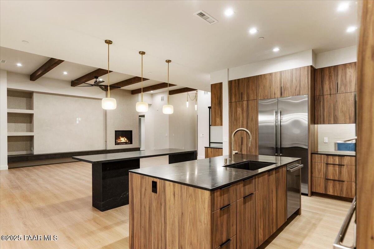 125 Rotonda Way Prescott, AZ 86301 - Photo 21 of 38 a kitchen with stainless steel appliances granite countertop a sink a stove and a refrigerator