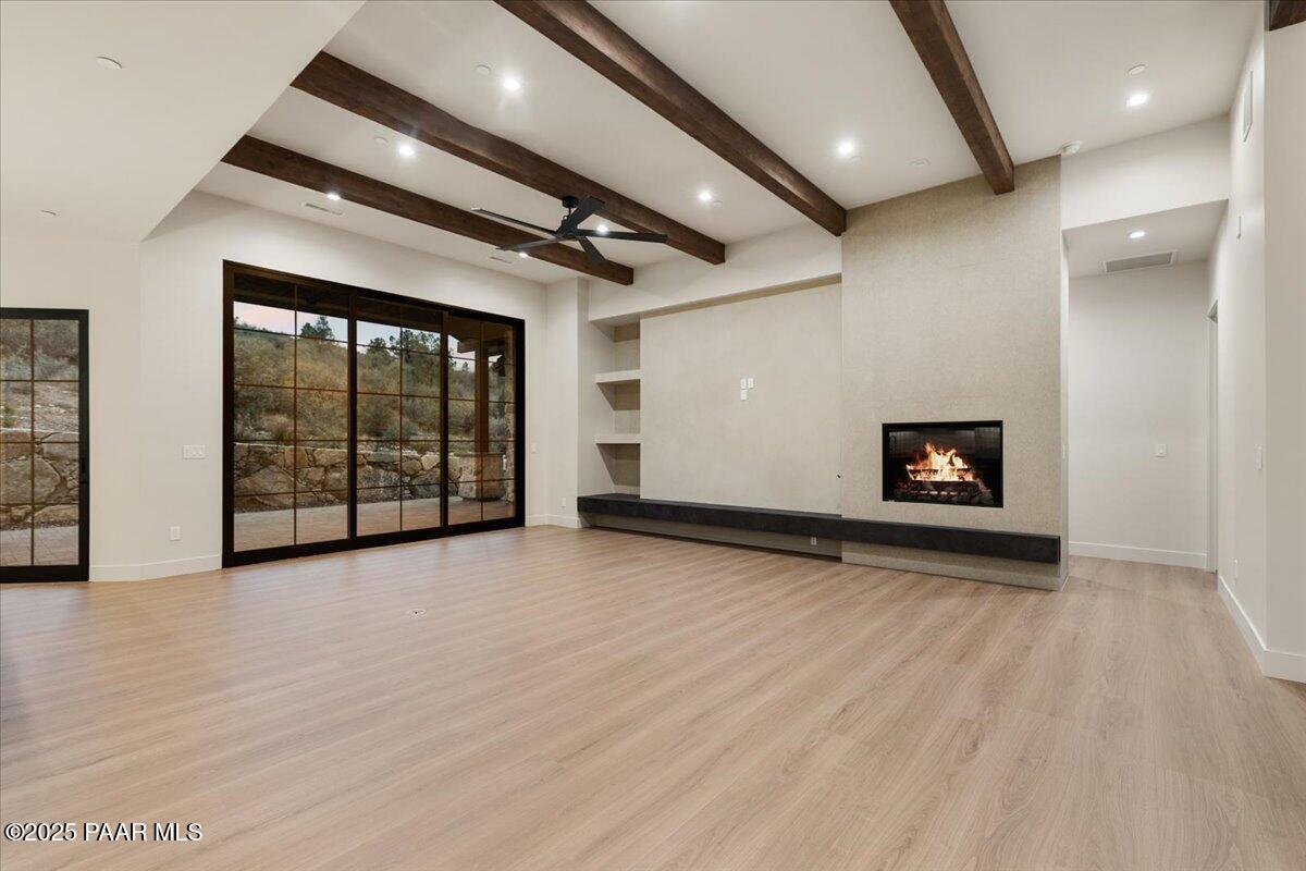 125 Rotonda Way Prescott, AZ 86301 - Photo 7 of 38 an empty room with wooden floor and windows