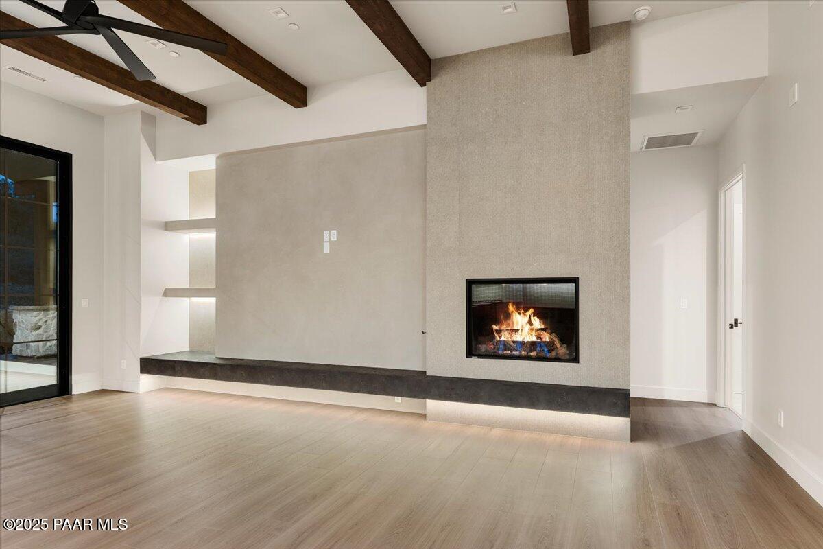 125 Rotonda Way Prescott, AZ 86301 - Photo 9 of 38 an empty room with wooden floor and windows