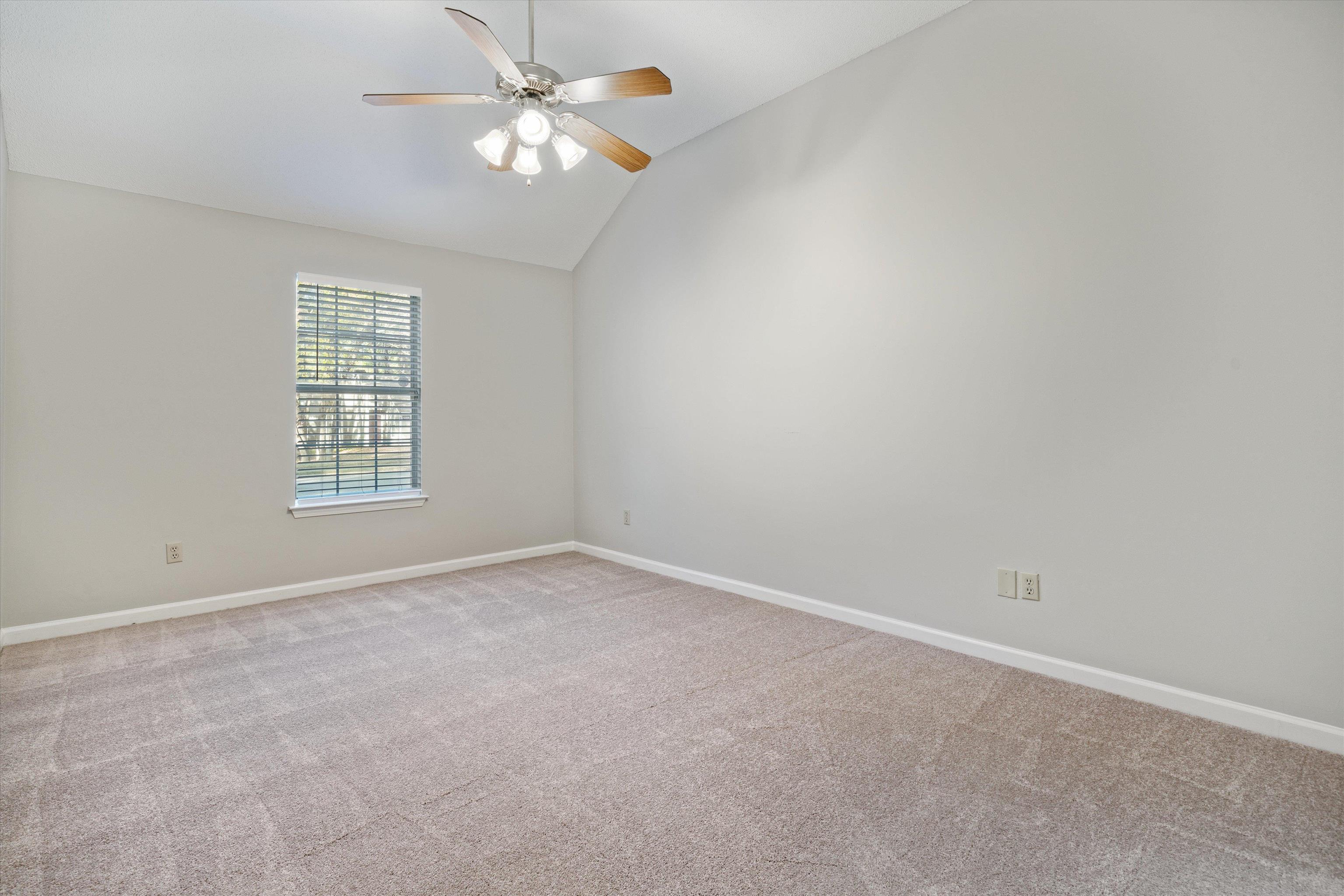 6511 Patmore Road Memphis, TN 38134 - Photo 11 of 22 en empty room with windows and ceiling fan