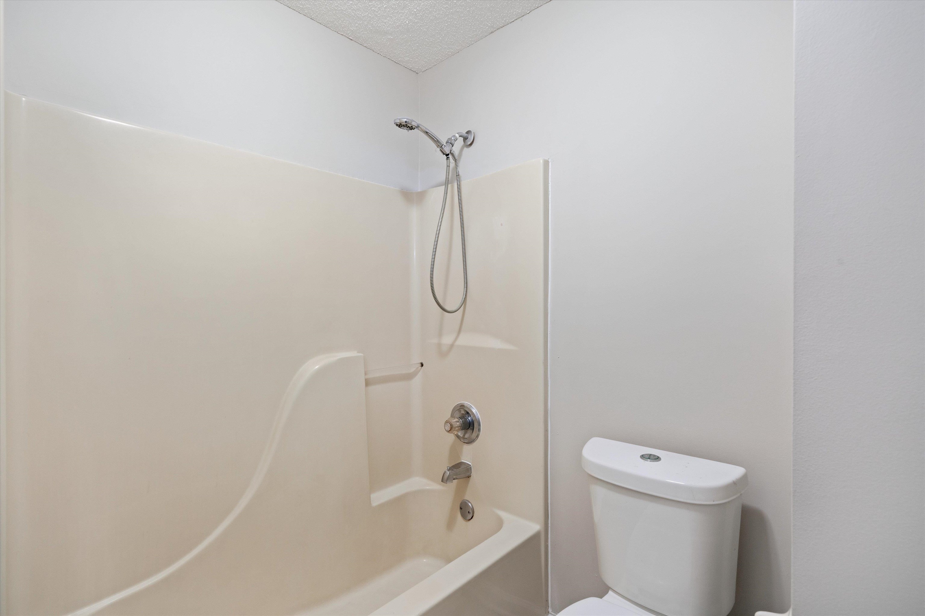 6511 Patmore Road Memphis, TN 38134 - Photo 14 of 22 a bathroom with a granite countertop bathtub shower and toilet