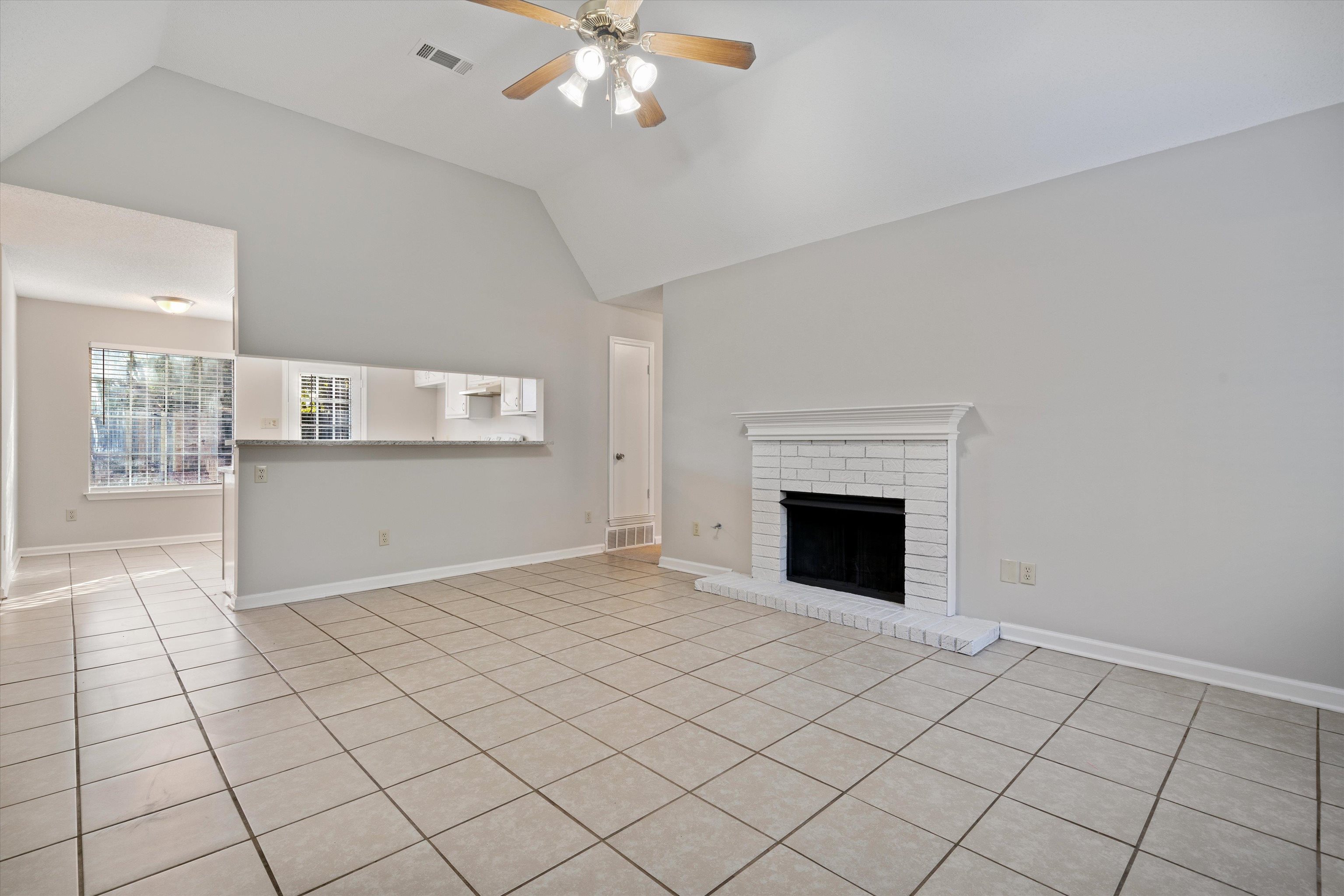 6511 Patmore Road Memphis, TN 38134 - Photo 3 of 22 a view of a livingroom with a fireplace cabinet and windows