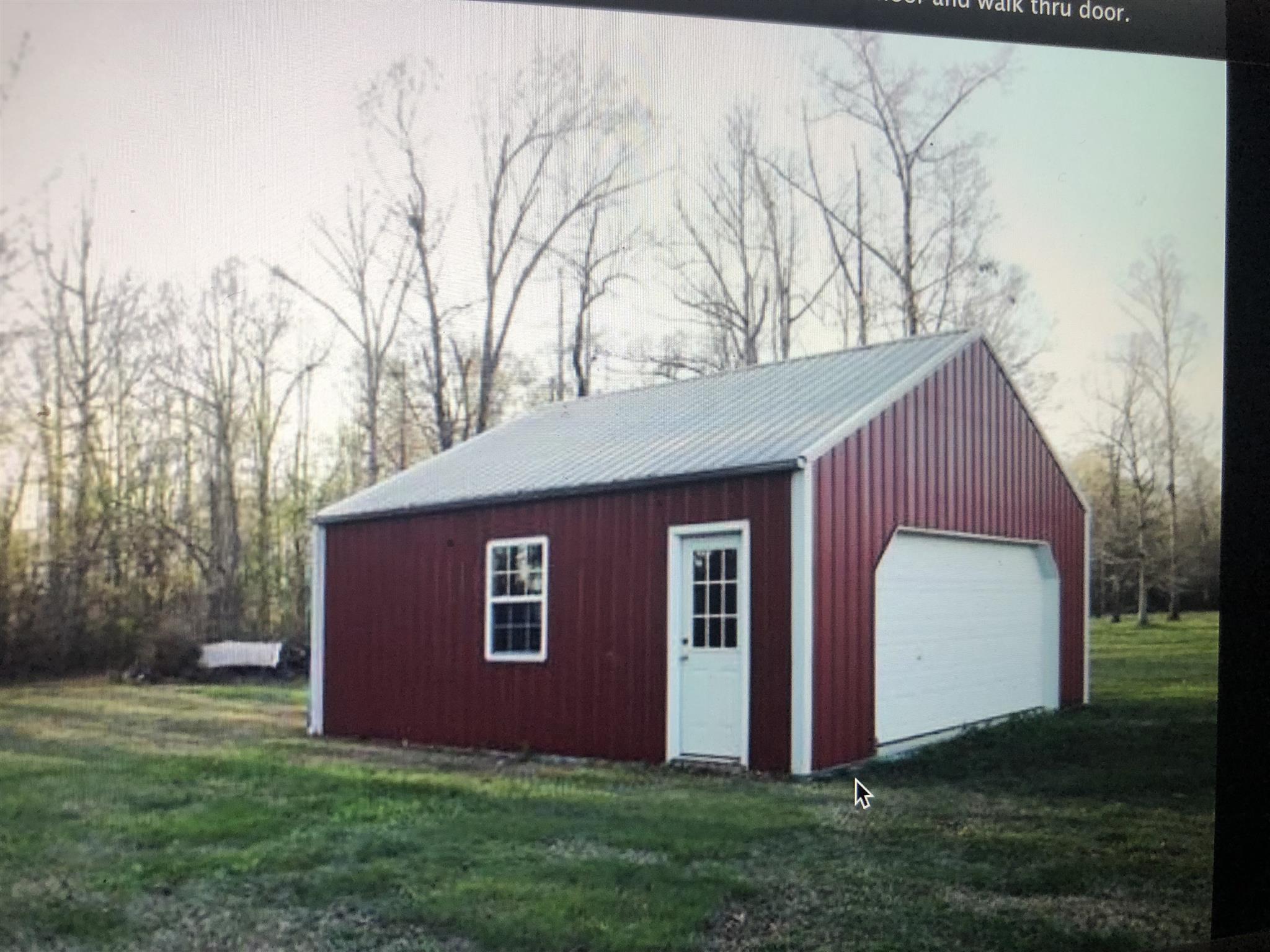 137 Cyril Wiser Road Manchester, TN 37355 - Photo 3 of 21 a view of backyard with large tree and wooden fence
