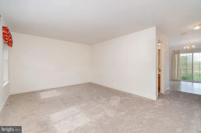 an empty room with entrance door