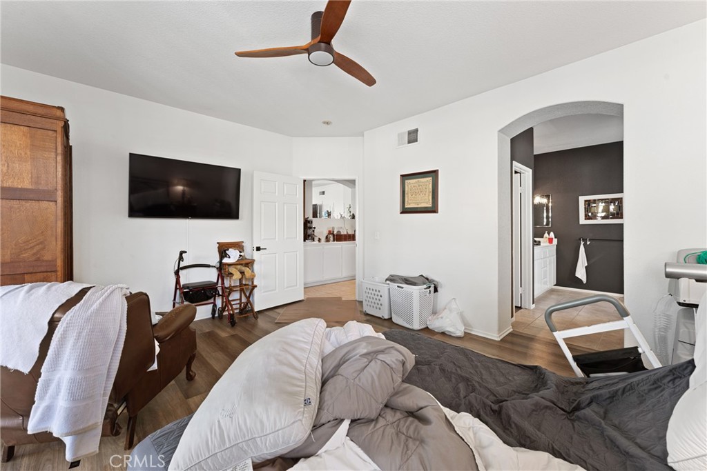 1851 Riviera Avenue Banning, CA 92220 - Photo 16 of 35 a bedroom with a bed and a flat screen tv