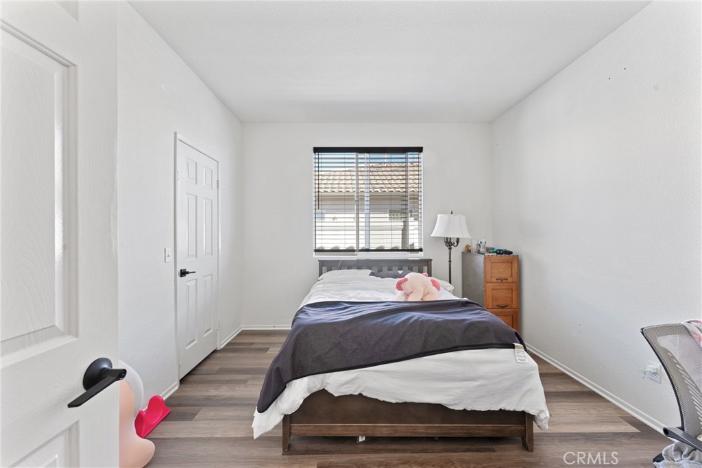1851 Riviera Avenue Banning, CA 92220 - Photo 20 of 35 a bedroom with a bed and window