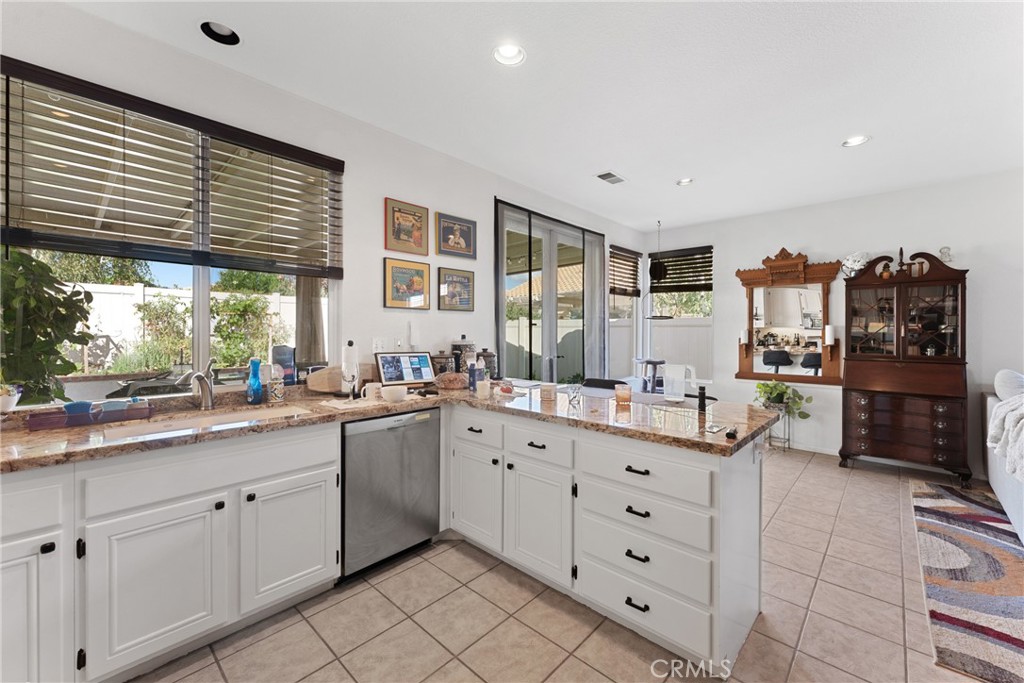 1851 Riviera Avenue Banning, CA 92220 - Photo 10 of 35 a large white kitchen with a large window