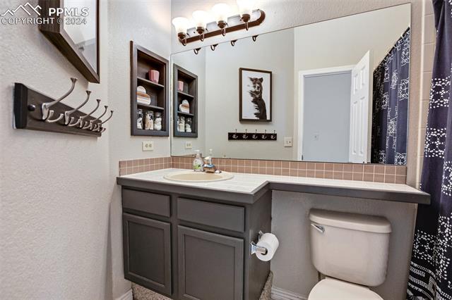 7725 Julynn Road Colorado Springs, CO 80919 - Photo 12 of 32 Guest Bathroom on Main Level