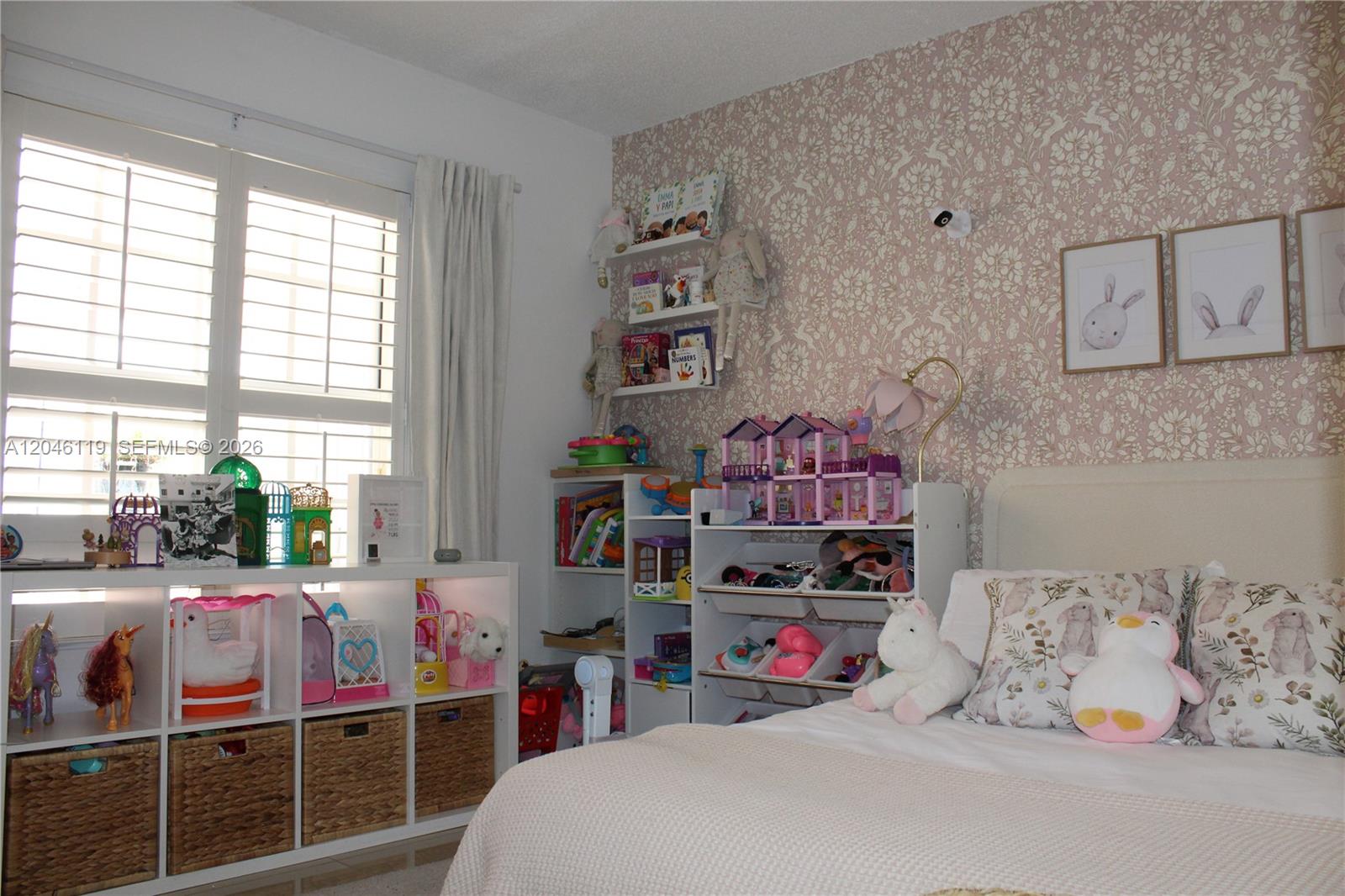 312 Bridgeton Road Weston, FL 33326 - Photo 3 of 13 a bedroom with a bed and a window