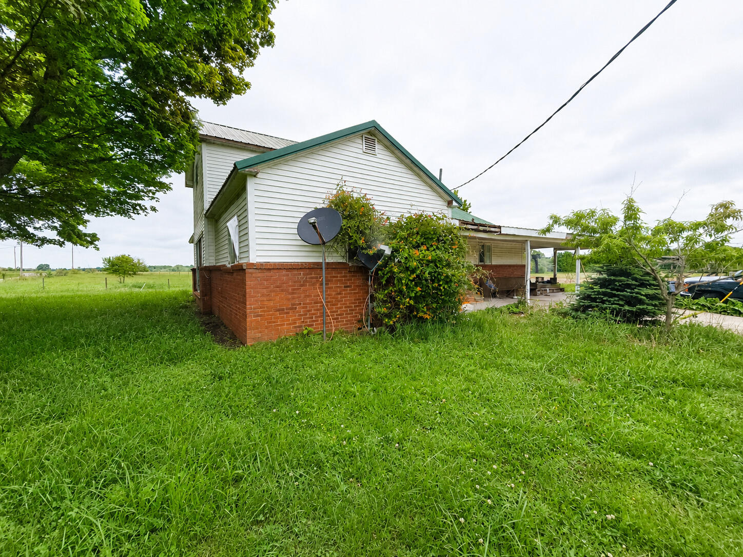 8545 Southeast Jeff Road Warren, IN 46792 - Photo 1 of 8 a backyard of a house with lots of green space