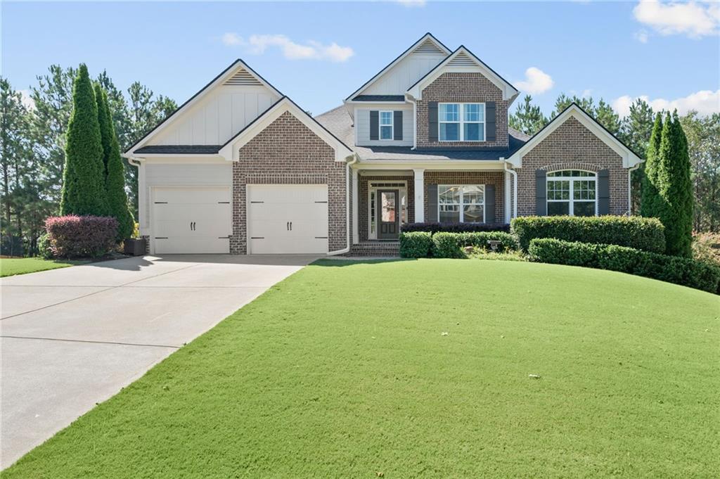 1685 Skymist Way Cumming, GA 30040 - Photo 1 of 1 a view of a yard in front of house