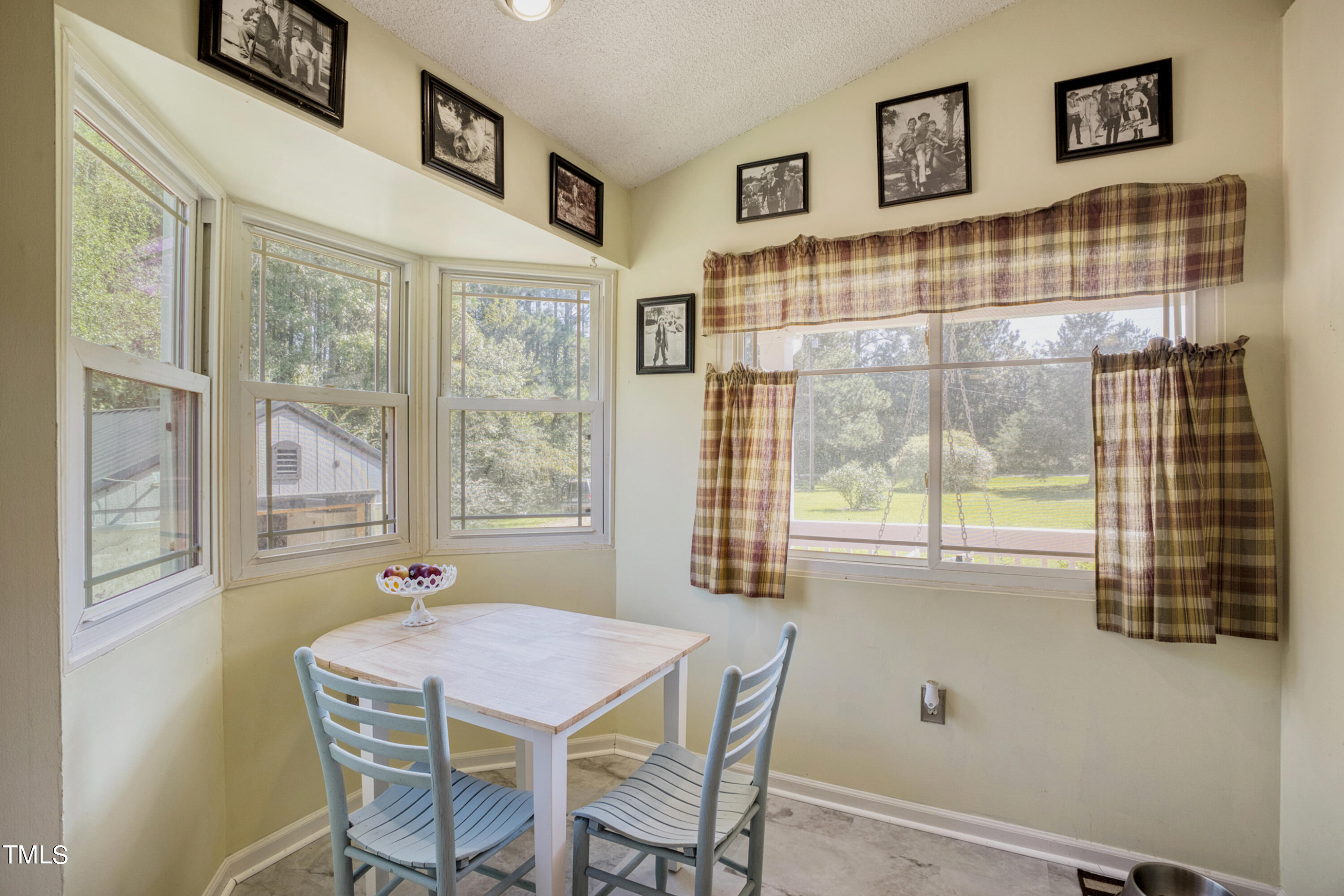 2650 Schloss Road Louisburg, NC 27549 - Photo 11 of 48 a view of a dining room with furniture window and outside view