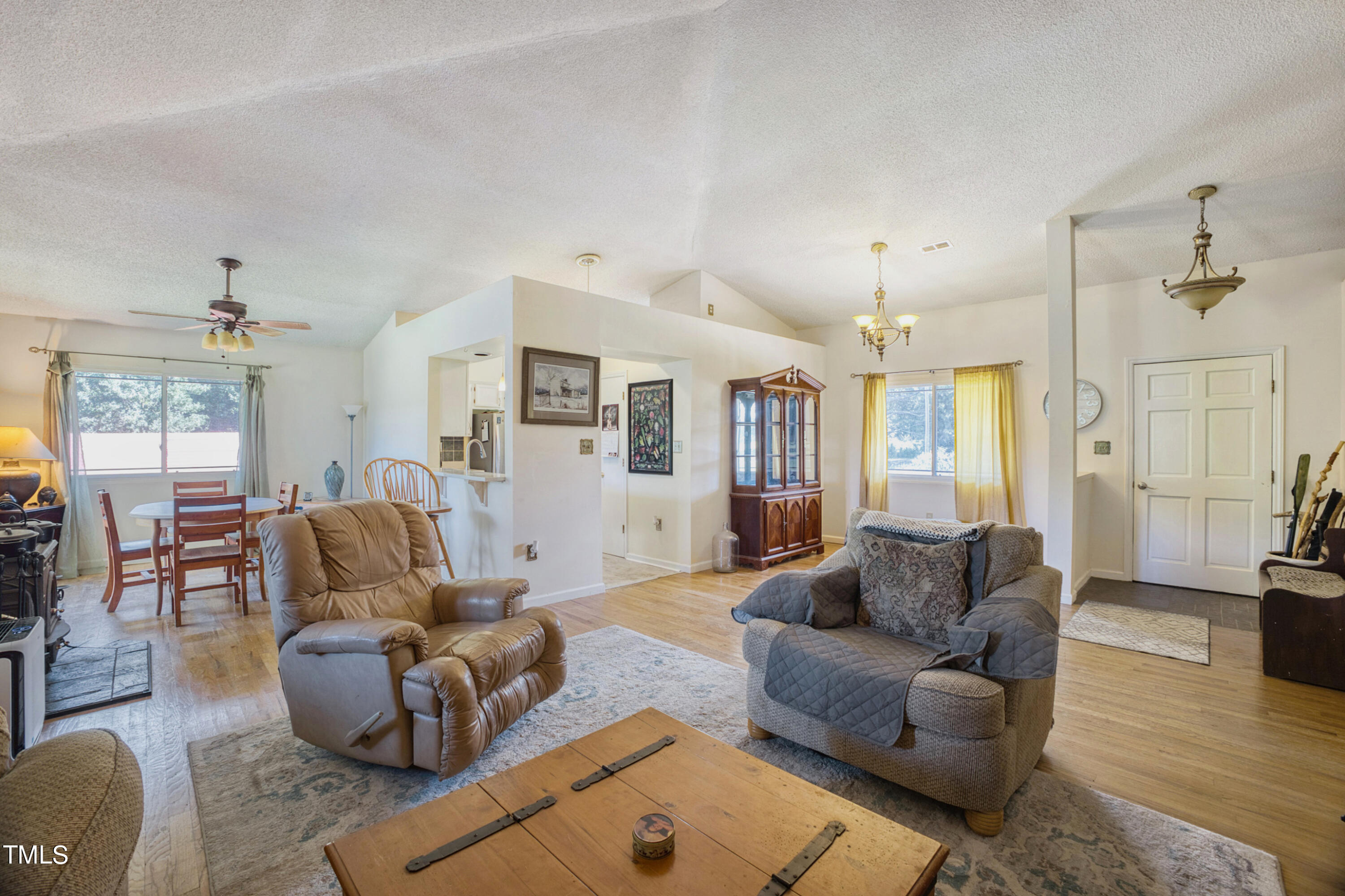 2650 Schloss Road Louisburg, NC 27549 - Photo 13 of 48 a living room with furniture wooden floor and a chandelier