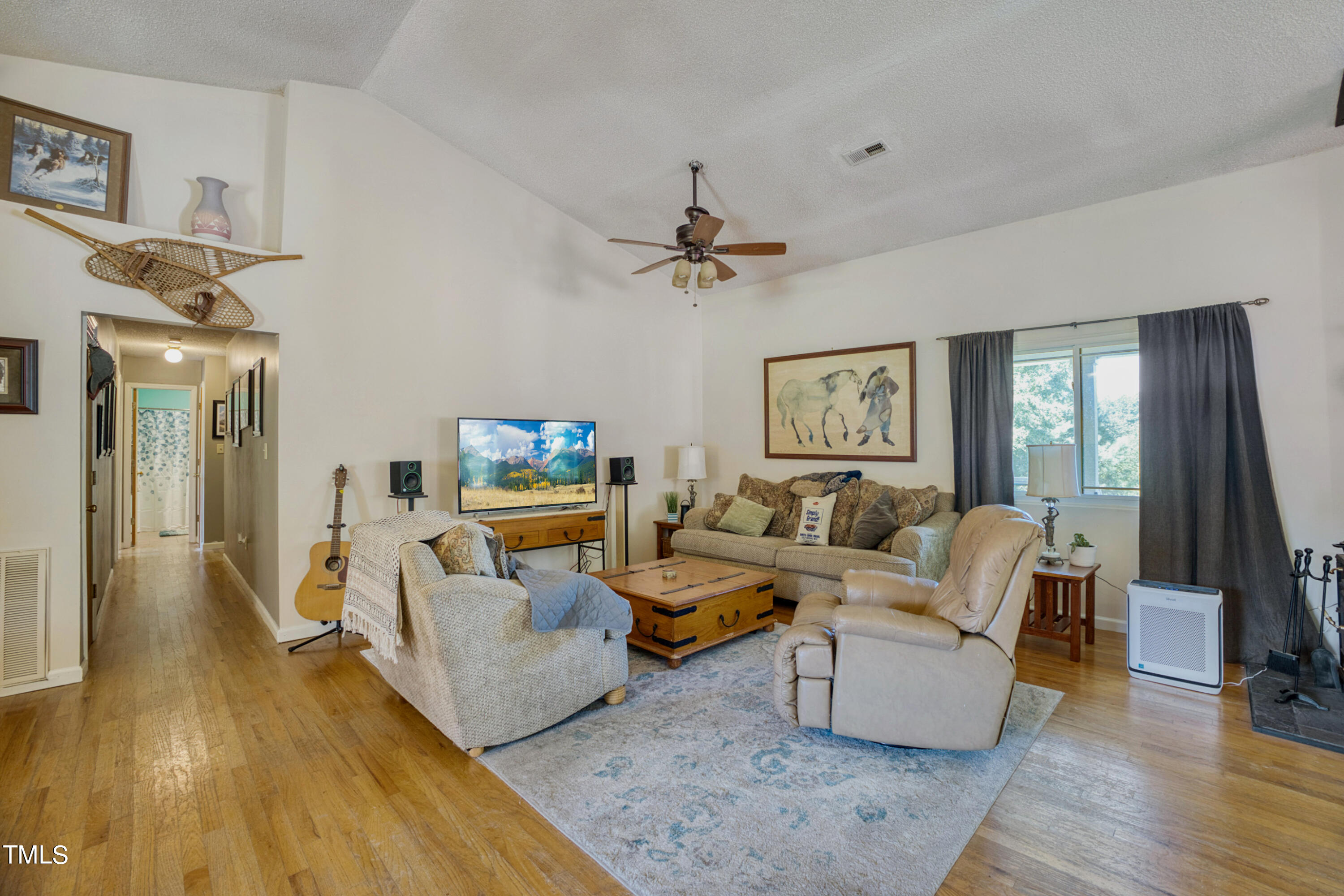 2650 Schloss Road Louisburg, NC 27549 - Photo 14 of 48 a living room with furniture and a flat screen tv
