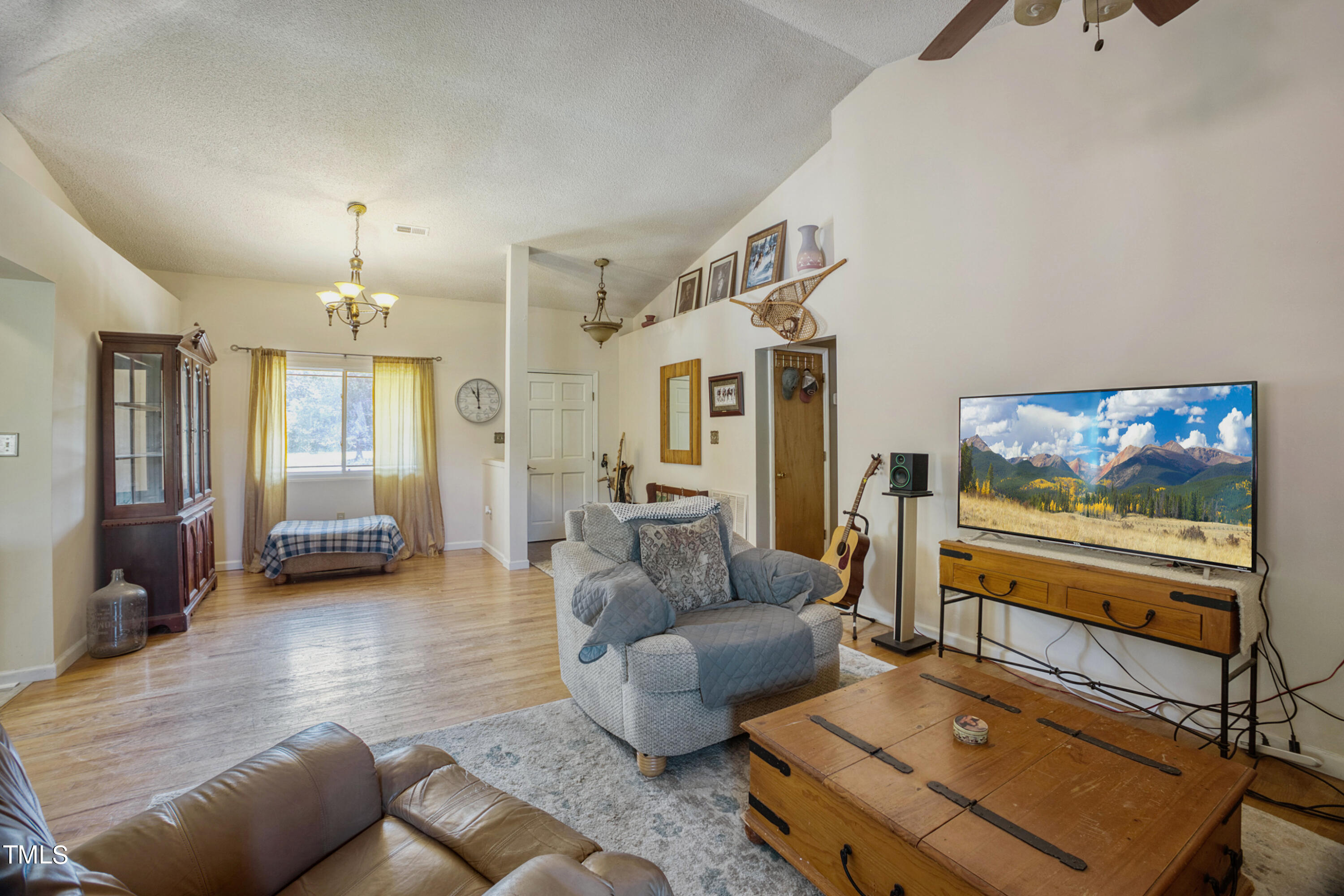 2650 Schloss Road Louisburg, NC 27549 - Photo 15 of 48 a living room with furniture and a flat screen tv