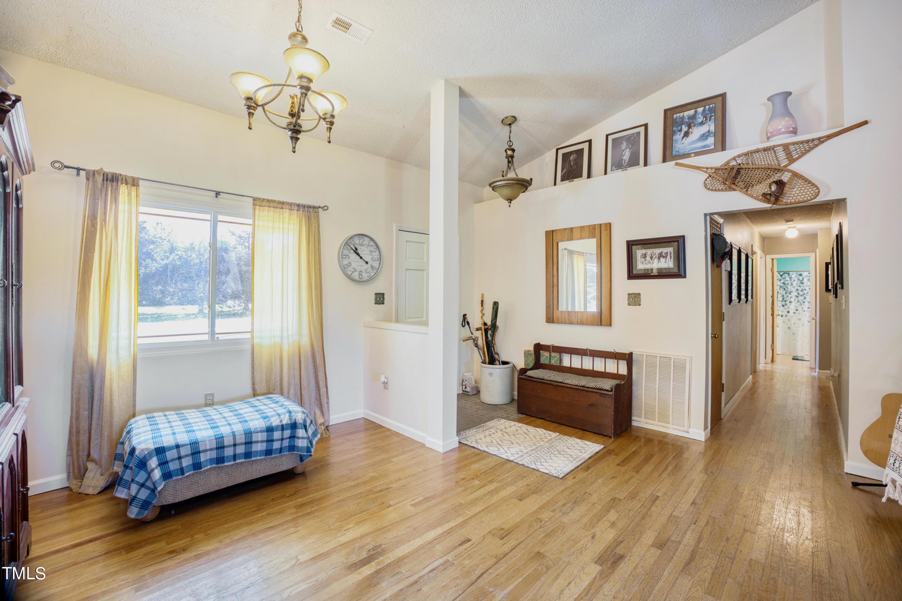 2650 Schloss Road Louisburg, NC 27549 - Photo 16 of 48 a bedroom with a bed and wooden floor