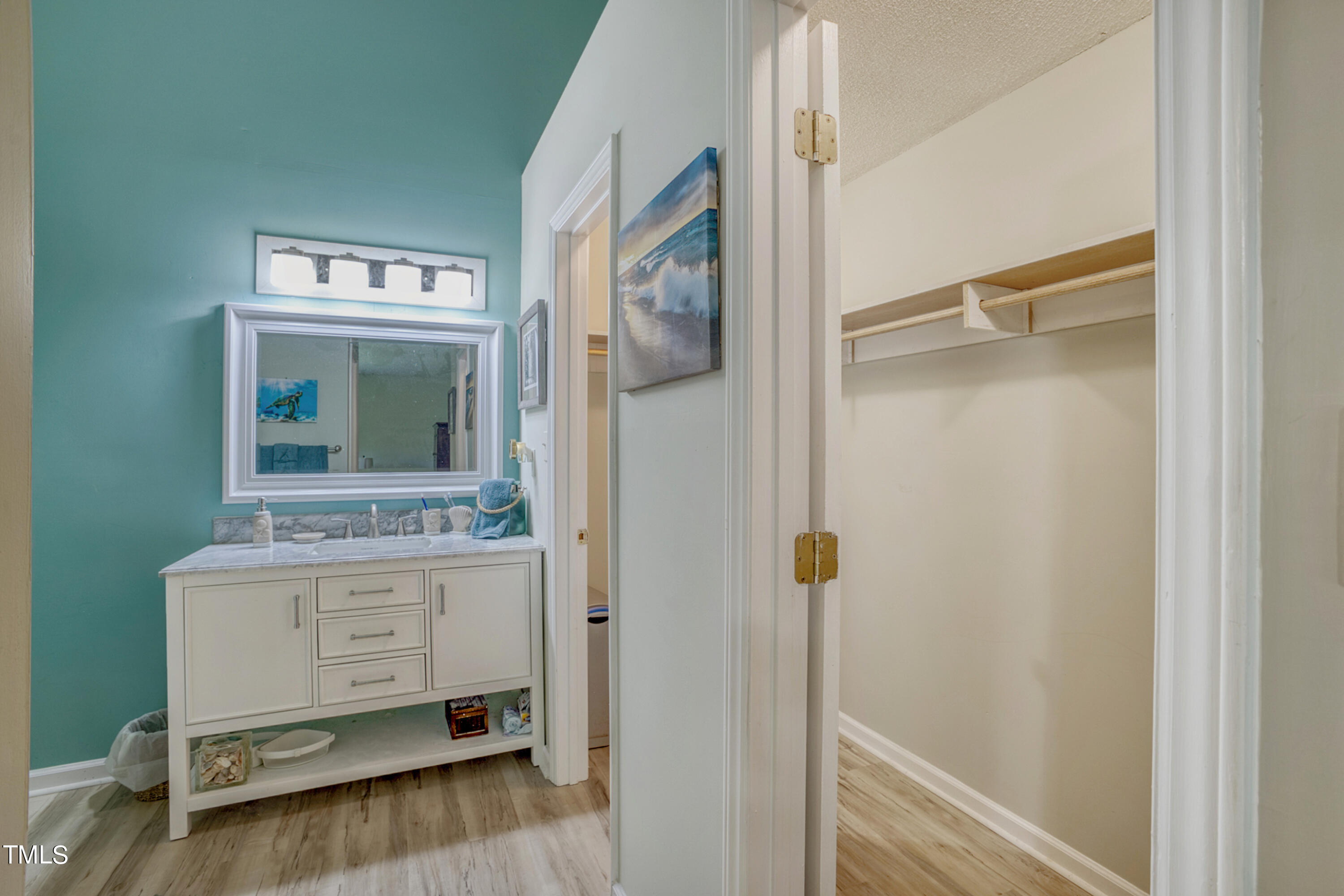2650 Schloss Road Louisburg, NC 27549 - Photo 22 of 48 a bathroom with a sink a mirror and a shower