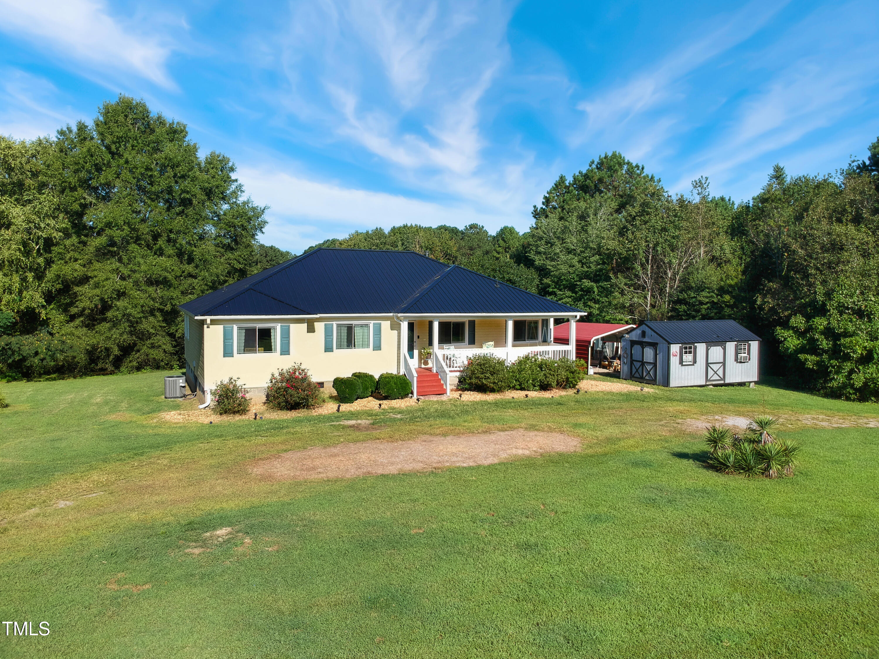 2650 Schloss Road Louisburg, NC 27549 - Photo 42 of 48 a front view of a house with a garden