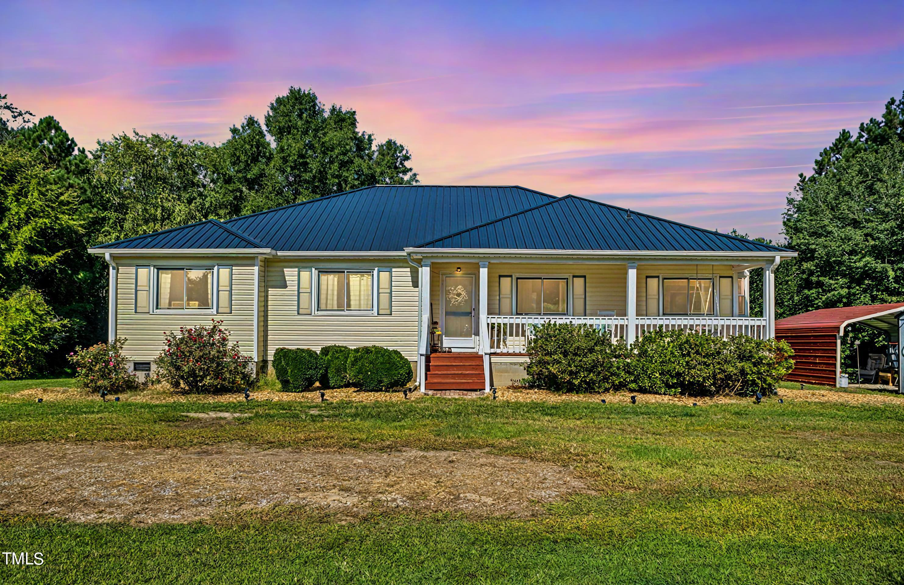 2650 Schloss Road Louisburg, NC 27549 - Photo 43 of 48 a front view of a house with a yard
