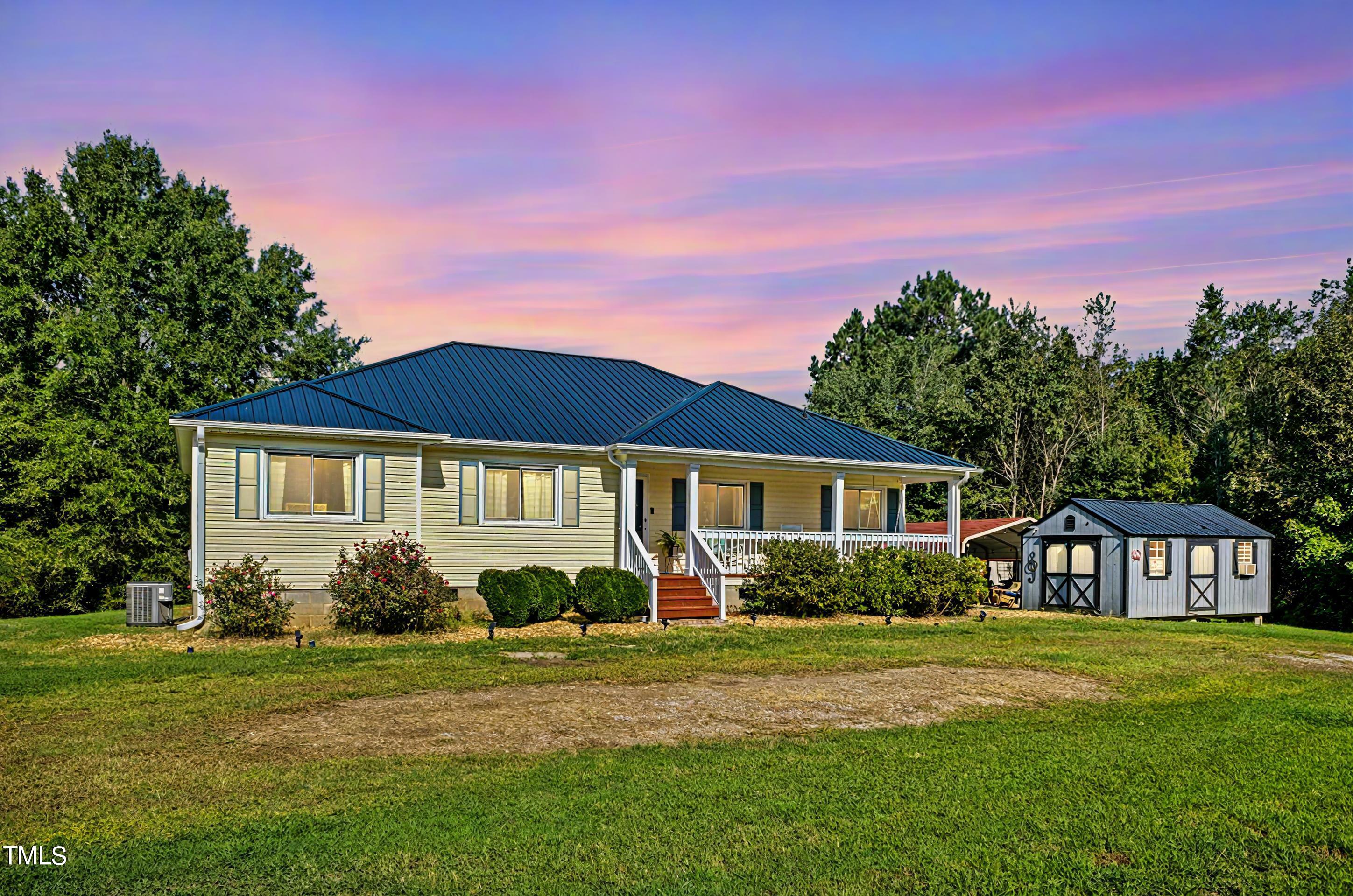 2650 Schloss Road Louisburg, NC 27549 - Photo 44 of 48 a front view of a house with garden