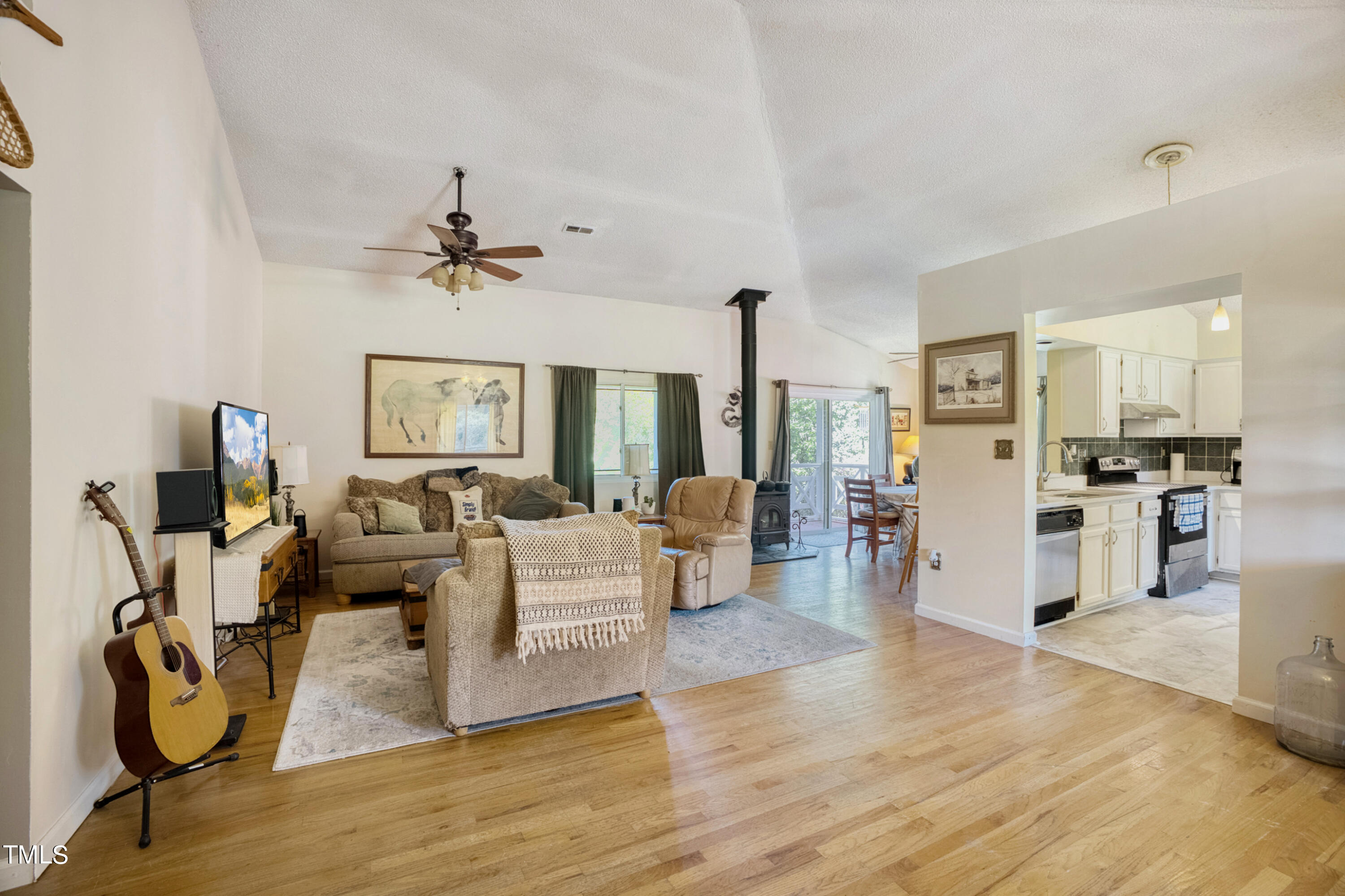 2650 Schloss Road Louisburg, NC 27549 - Photo 7 of 48 a living room with furniture windows and a chandelier