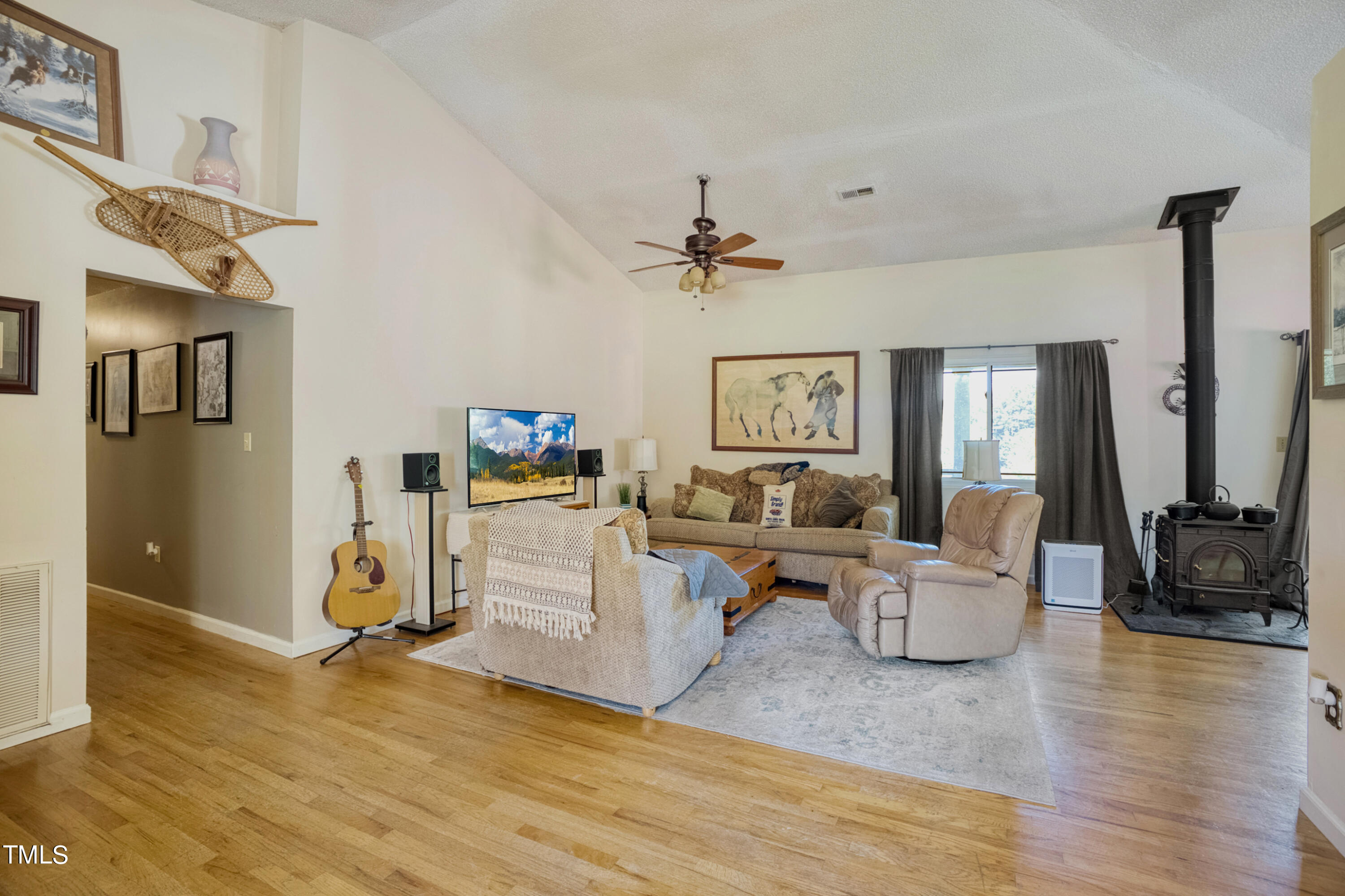 2650 Schloss Road Louisburg, NC 27549 - Photo 8 of 48 a living room with furniture and a flat screen tv