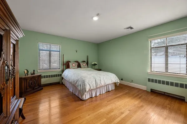 a bed room with a bed and a window