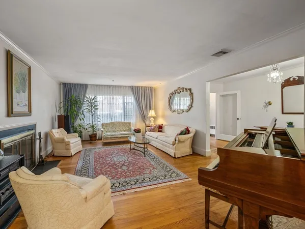 a living room with furniture rug and window
