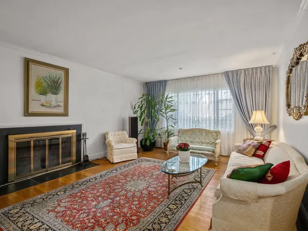 a living room with furniture and a rug