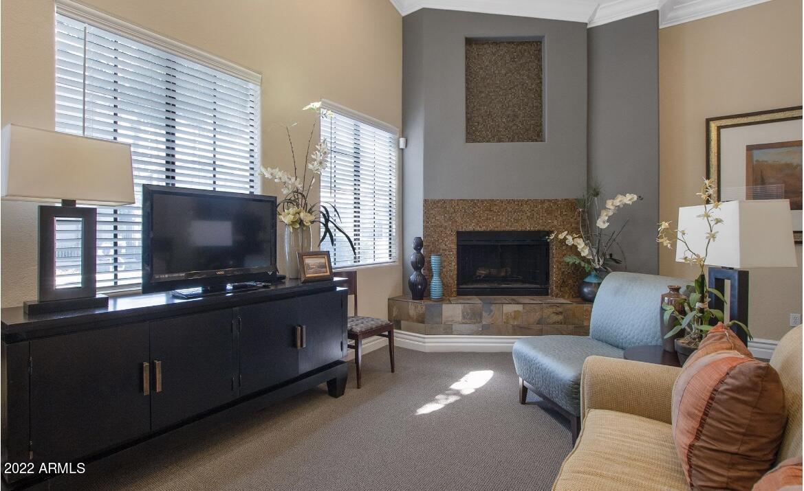 2025 East Campbell Avenue, Unit 247 Phoenix, AZ 85016 - Photo 13 of 18 a living room with furniture and a flat screen tv