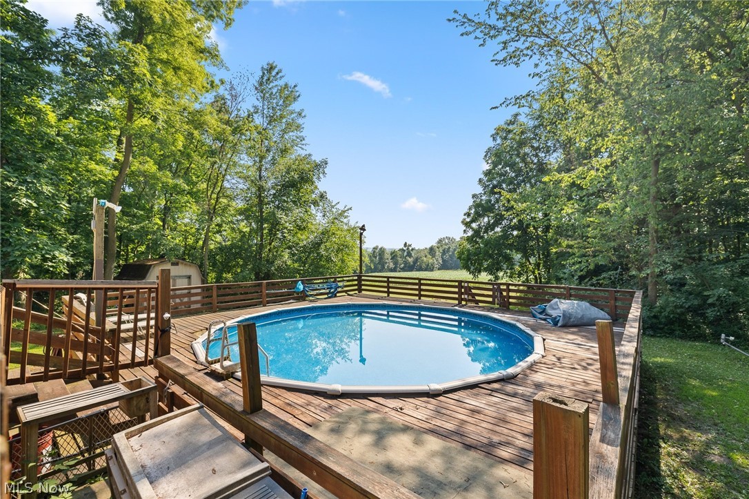2335 South Funk Road Wooster, OH 44691 - Photo 28 of 47 View of pool featuring a deck and a storage unit